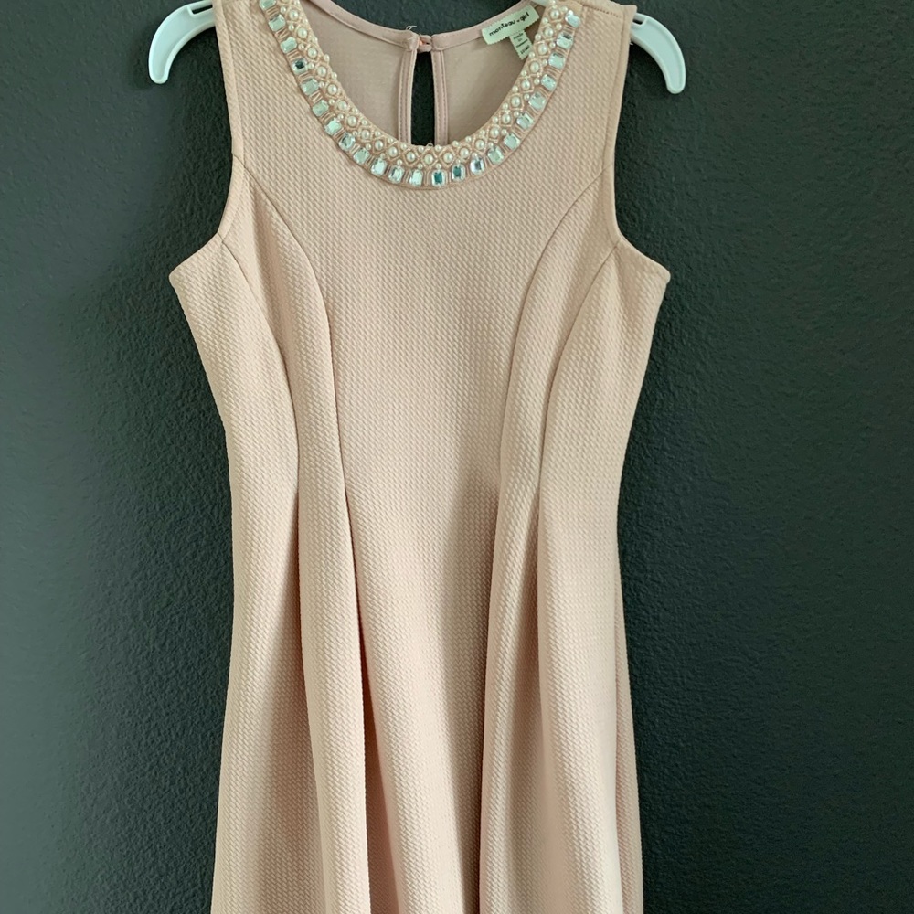 Weekend afternoon dress, bejeweled around the neck and patterned on the bottom.